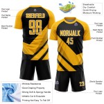 Uniforme de fútbol de sublimación con formas de flecha, camiseta dorada personalizada, negro y blanco Uniforme de fútbol de sublimación con formas de flecha, camiseta dorada personalizada, negro y blanco